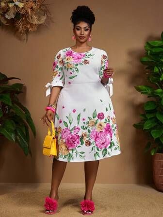 White midi dress with bold pink and green floral print